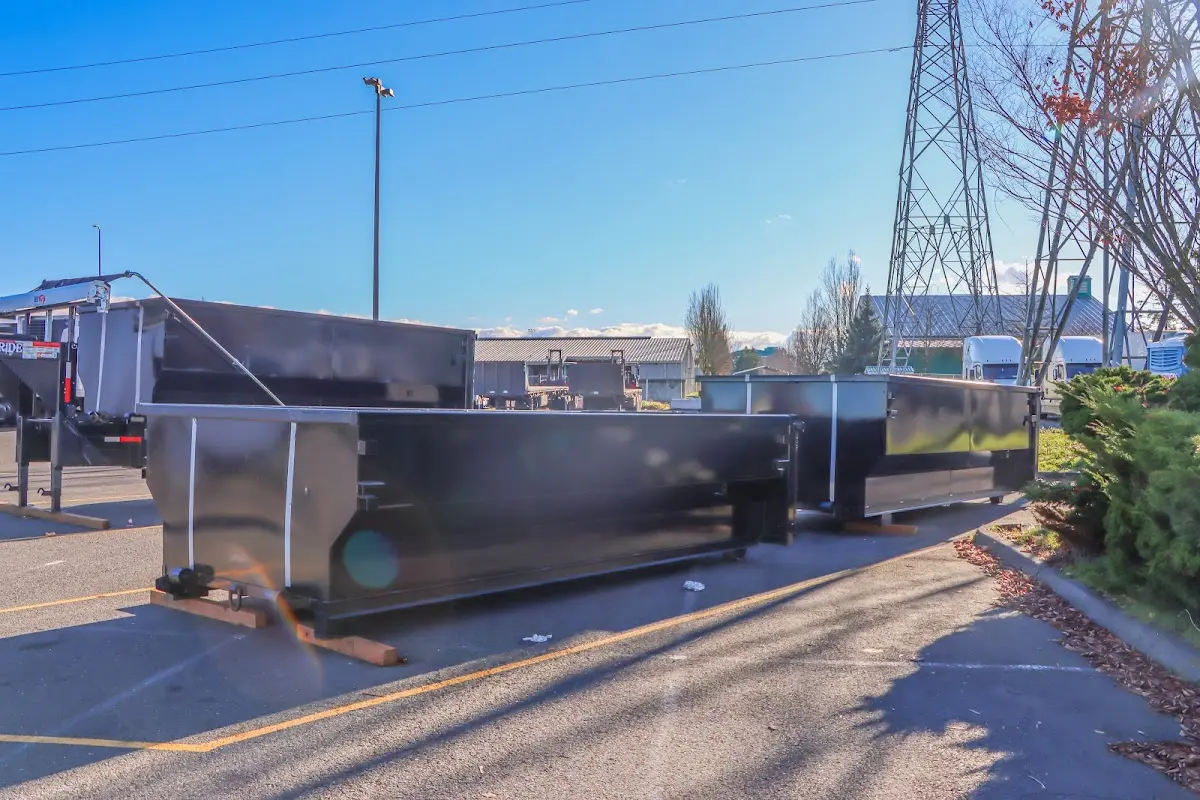 Roll-off dumpster ready for waste disposal at job site for 2 Yard Dumpster Rental in Oakhurst